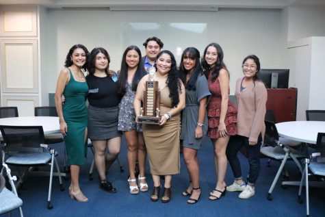 NAHJ DePaul members hoist the trophy they won at the NAHJ and NABJ Conference and Job Fair.