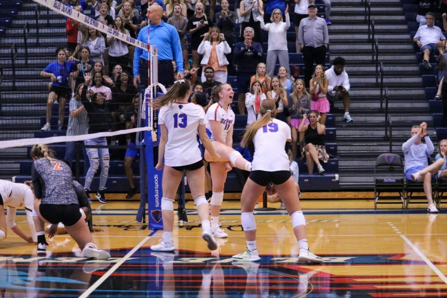 Senior Bailey Nelson celebrates with teammates during DePauls match with Virginia Tech on Saturday.