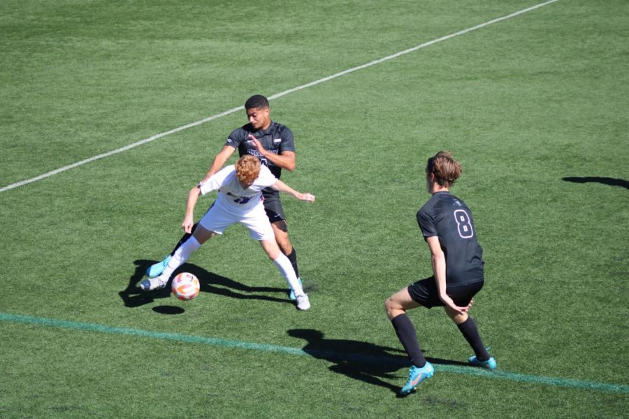 Junior midfielder Jacob Huth tries to get past two Providence defenders in Saturday’s 1-0 loss.