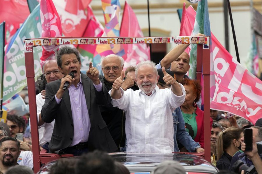 Former President Luiz Inacio Lula da Silva gives a thumbs up to supporters.