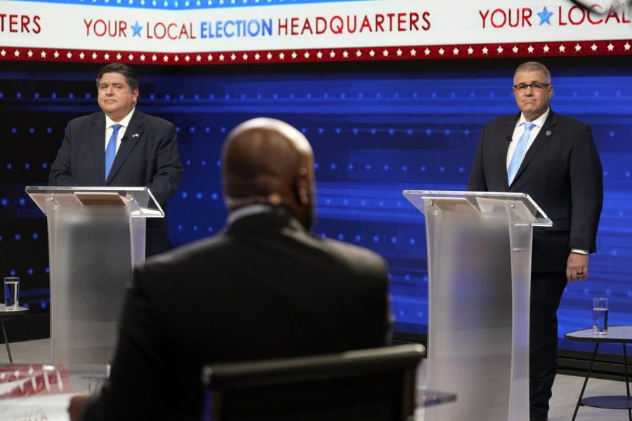 Illinois Gov. JB Pritzker, left, and Republican gubernatorial challenger state Sen. Darren Bailey participate in the Illinois Governors Debate at the WGN9 studios, Tuesday, Oct. 18, 2022, in Chicago. 