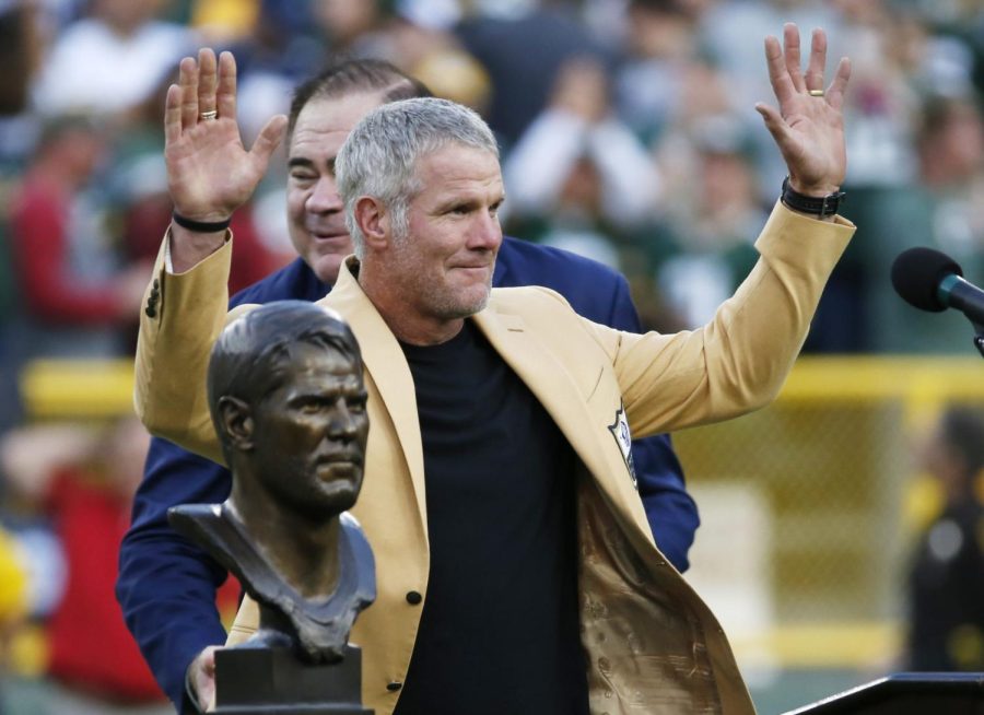 Former Green Bay Packers Brett Favre acknowledges the crowd during a halftime ceremony of an NFL football game against the Dallas Cowboys Sunday, Oct. 16,2019, in Green Bay, Wis.