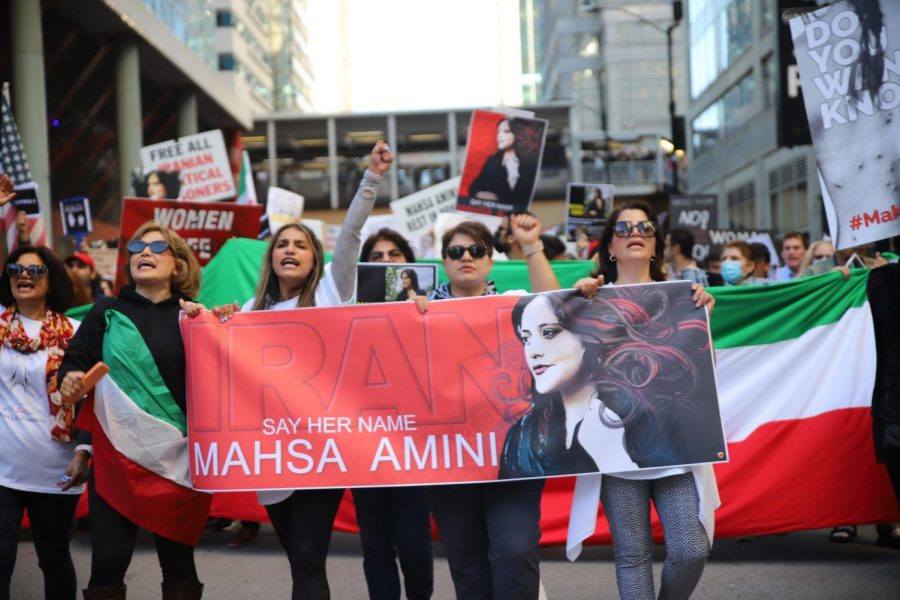 Protesters gather together in the Chicago Loop on Saturday, Oct. 1, to raise awareness for injustices against women in Iran.