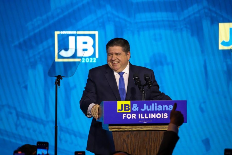 Gov. JB Pritzker smiles to supporters after declaring victory in the Illinois governors race over Republican Darren Bailey at the Chicago Marriott Marquis hotel Tuesday night. 