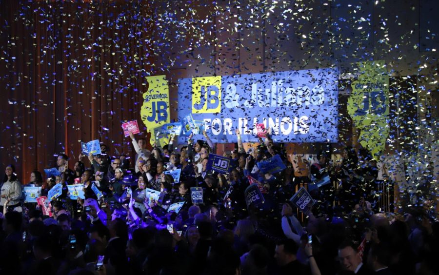 Confetti rains down over a group of supporters at Gov. Pritzkers victory party at the Marriott Marquis in  Chicago Tuesday night.