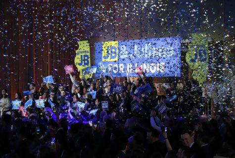 Confetti rains down over a group of supporters at Gov. J.B. Pritzkers victory party at the Marriott Marquis in Chicago on the night of Tuesday, Nov. 8.