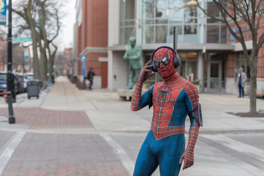 Dylan Lawerence dressed in a Spider-Man costume, prepares for a run around Lincoln Park campus. Lawerence wears the Spider-Man costume to to lift the spirits of DePaul students.