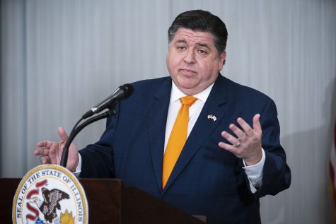 Illinois Gov. J.B. Pritzker answers questions from the media during a press conference at the Marriott Marquis Hotel in Chicago, Wednesday, Nov. 9, 2022.  A variety of new laws take effect Sunday, Jan. 1, 2023 that could have an impact on peoples finances and, in some cases, their personal liberties. 