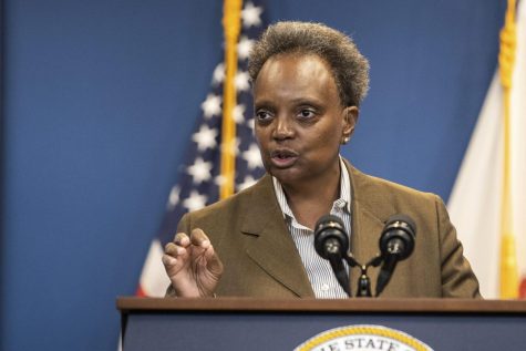 Caption: Chicago Mayor Lori Lightfoot speaks during a press conference in the Greektown neighborhood, of Chicago, Sept. 14, 2022. Lightfoot is one of nine candidates running.
