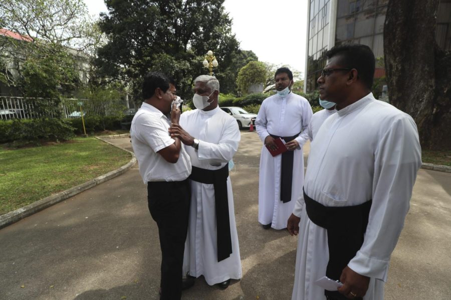 A Catholic priest consoles a family member of one of the deceased after Sri Lanka’s Supreme Court pronounced judgment on the 2019 bombings.