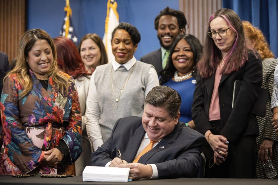 Gov. J.B. Pritzker signs House Bill 4664, legislation that will protect reproductive health care providers and patients who are seeking care in Illinois on Friday, Jan. 13.