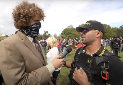Andrew Callaghan (Left) speaks with Proud Boys leader Enrique Tarrio in Portland, Ore. for Proud Boys Rally Oct. 3, 2020