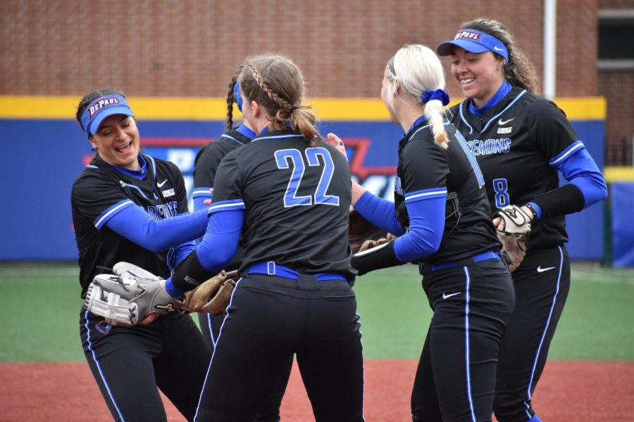 Sophomore+catcher+Anna+Wohlers+and+senior+first+basemen+Brooke+Johnson+celebrate+with+their+teammates+after+their+7-1+victory+over+Villanova+on+April+4%2C+2022.