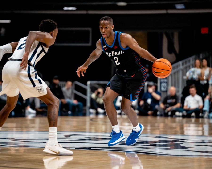 Graduate Senior guard Umoja Gibson dribbles at the top of the key against the Butler Bulldogs Graduate Senior guard Eric Hunter Jr. during Wednesday’s 78-70 loss at the Hinkle Fieldhouse.