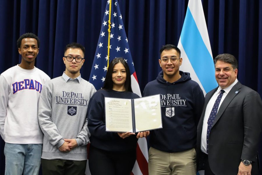 DePaul students (from left) Tommy Le, Erick Quezada, Julianna De Leon and Jaylen Johnson joined DePaul president Robert L. Manuel at Chicago City Council Wednesday as university was commemorated for its 125th year.