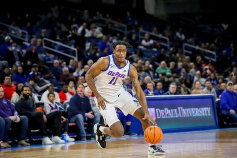 Graduate Forward Eral Penn dribbles up the court and drives down the lane to score a basket during DePaul’s 75-65 win over Villanova. Penn recorded 11 points, five rebounds and two blocks.