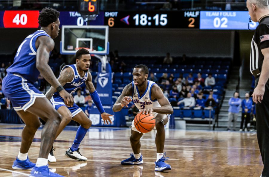 Graduate guard Umoja Gibson tries to avoid two Seton Hall defenders in DePauls loss to the Pirates at Wintrust Arena on Saturday.