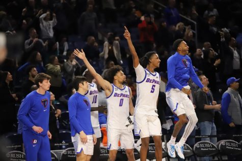 (From left) Brendan Favre, Max Williams, Zion Cruz, Philmon Gebrewhit and K.T. Raimey celebrate during DePaul’s 73-72 win over No. 8-ranked Xavier on Wed. Jan 18 at Wintrust Arena.