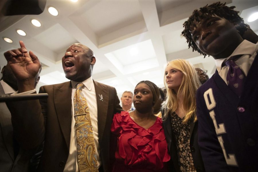 Attorney Ben Crump stands with three high school students who plan to sue Fla. Gov. DeSantis over ban of AP African American Studies course.