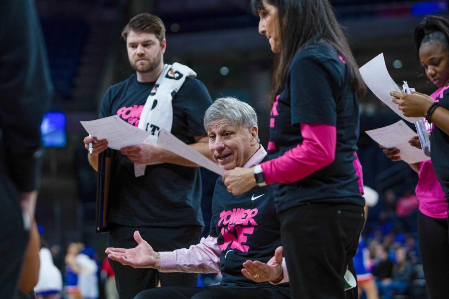 Head coach Doug Bruno goes over the gameplan during a timeout on Saturday against Xavier.