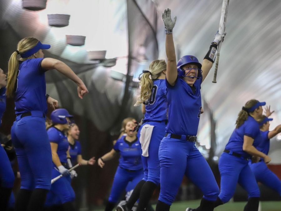 Senior centerfielder Tori Meyers and teammates celebrate Saturday night’s 2-1, walk-off win against Evansville as DePaul finished the DePaul Dome Tournament undefeated 4-0 to start the season.