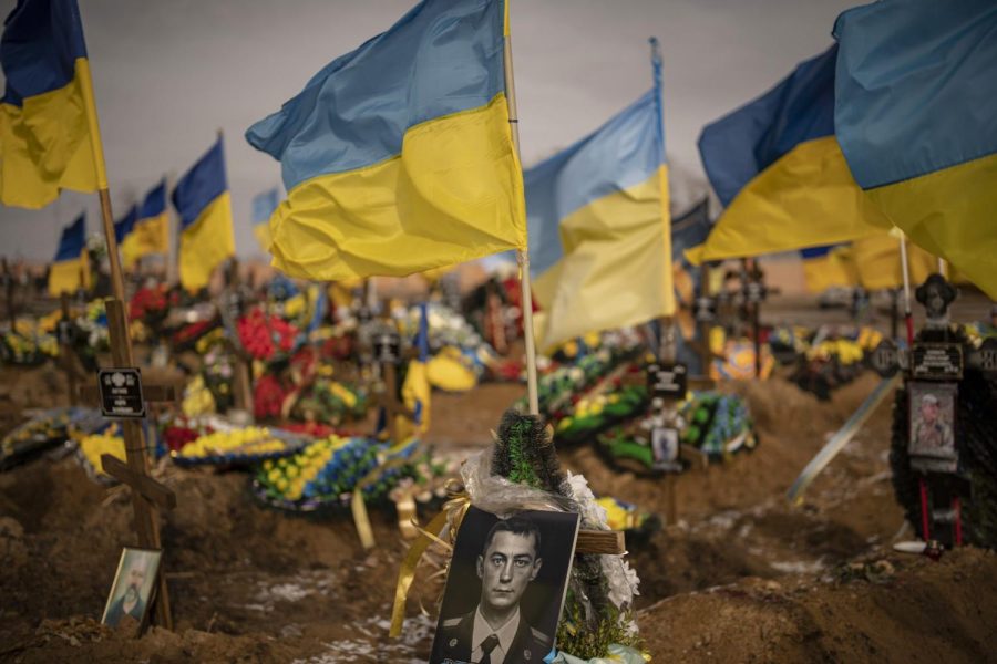 A+photograph+of+a+Ukrainian+serviceman+adorns+a+grave+in+the+Alley+of+Glory+portion+of+the+cemetery%2C+in+Kharkiv%2C+Ukraine.