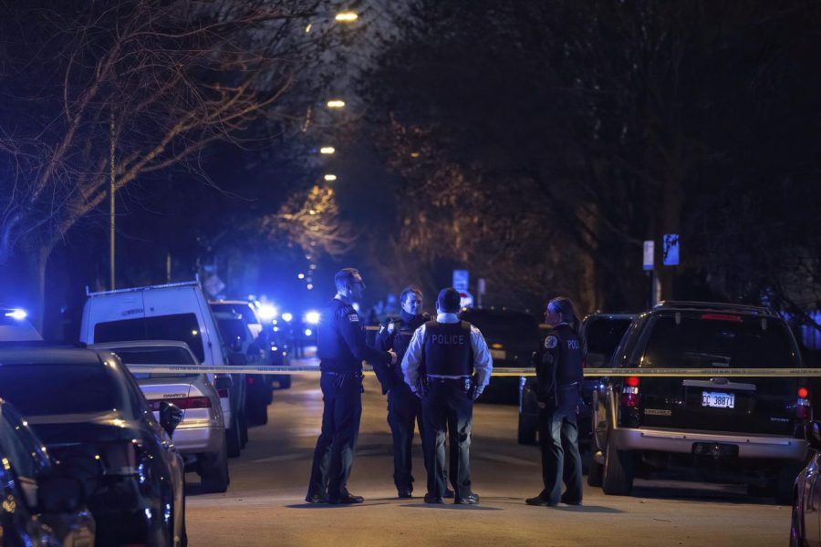 Chicago police surround the scene where an officer was shot and killed in the 5200 block of S. Spaulding Ave., in the Gage Park neighborhood of Chicago on March 1.
