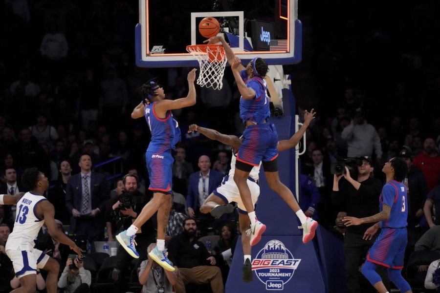 DePauls Nick Ongenda (14) blocks a last second shot by Seton Halls Femi Odukale (21) in the second half of an NCAA college basketball game during the first round of the Big East conference tournament, Wednesday, March 8, 2023, in New York.
