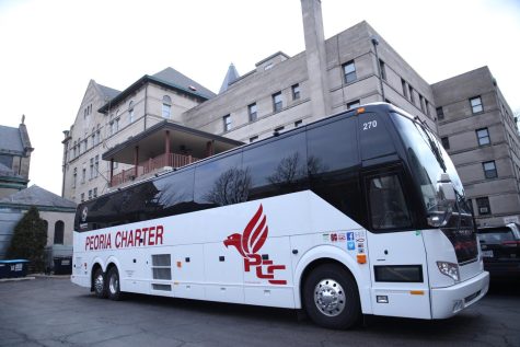 A bus at DePauls Lincoln Park campus awaits a load of students to shuttle to the Loop. 