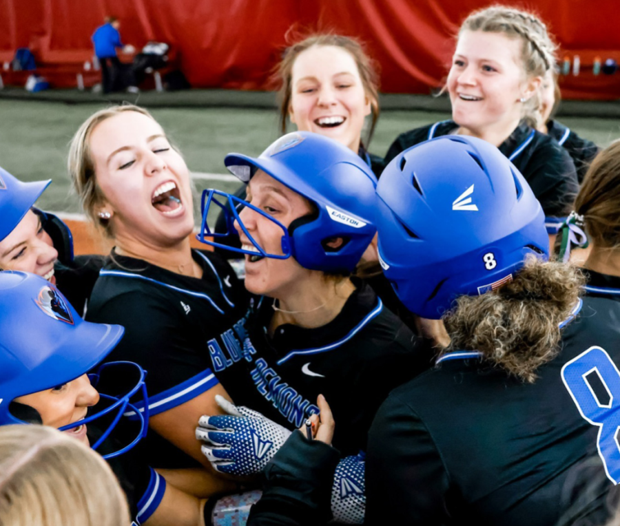 Meyer (center) celebrates with her DePaul teammates after picking up a victory last season.