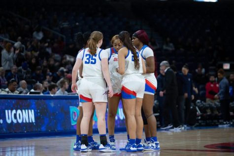 DePaul players huddle together in a Feb. 25 loss to UConn at Wintrust Arena.
