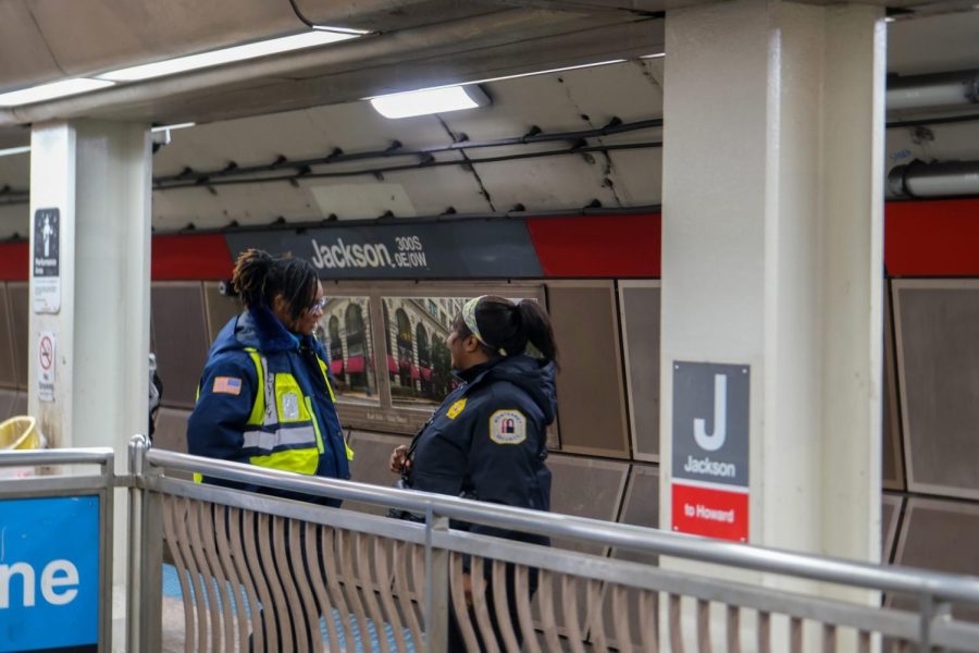 Two CTA private security speak at the Jackson Red Line station on a weekday afternoon.