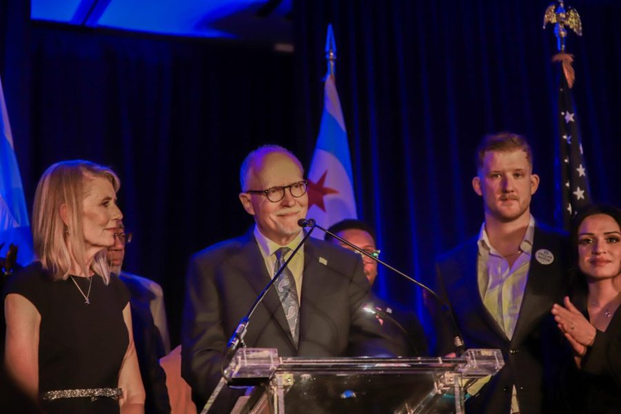 Paul Vallas address a crowd of supporters alongside his family following the results of Tuesday's election in which his opponent, Brandon Johnson, won the race for Chicago mayor.