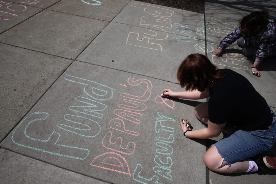 Student protestors cover the sidewalk outside the Lincoln Park Student Center, on the corner of Sheffield Ave. and Belden Ave. with phrases in support of DePaul faculty and staff.