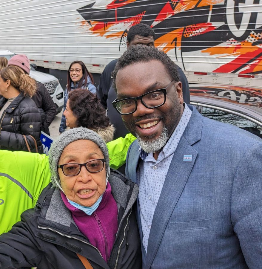 Gloria Drew, 70, poses with mayoral elect Brandon Johnson. 