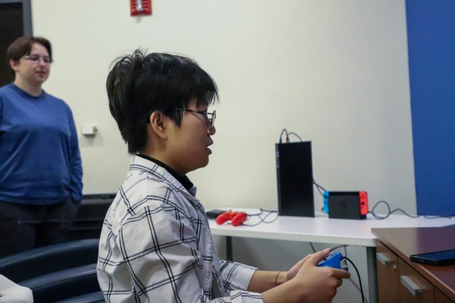 Qiling Jiang plays Pac-Man in the Loop Life Office of Student Involvement. The event ran from 11 a.m. - 4 p.m., on Wednesday. 
