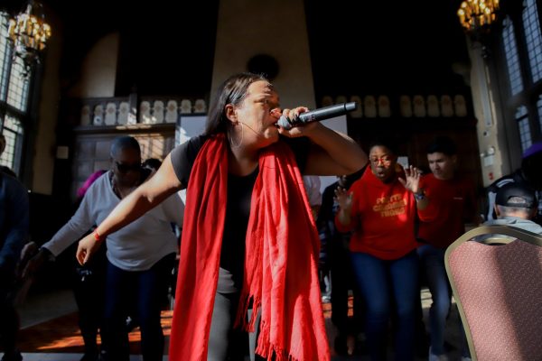 Ivelisse Diaz, founder of Las BomPlaneras Unplugged, sings and dances to Bomba music during the 55 year celebration of the Young Lords at DePauls Cortelyou Commons on Sept. 18. Diaz brought students and faculty on stage with her, where she taught them steps and songs to Bomba music.