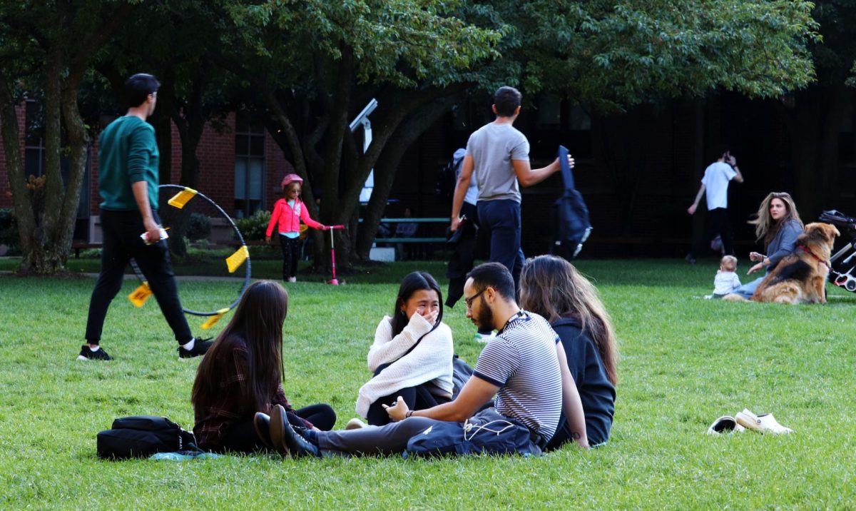Students+laugh+while+gathered+on+the+Lincoln+Park+quad+on+Thursday%2C+Sept.+14%2C+2023%2C+in+Chicago.+Various+other+groups+were+playing+field+games+like+Spike+Ball+or+studying.
