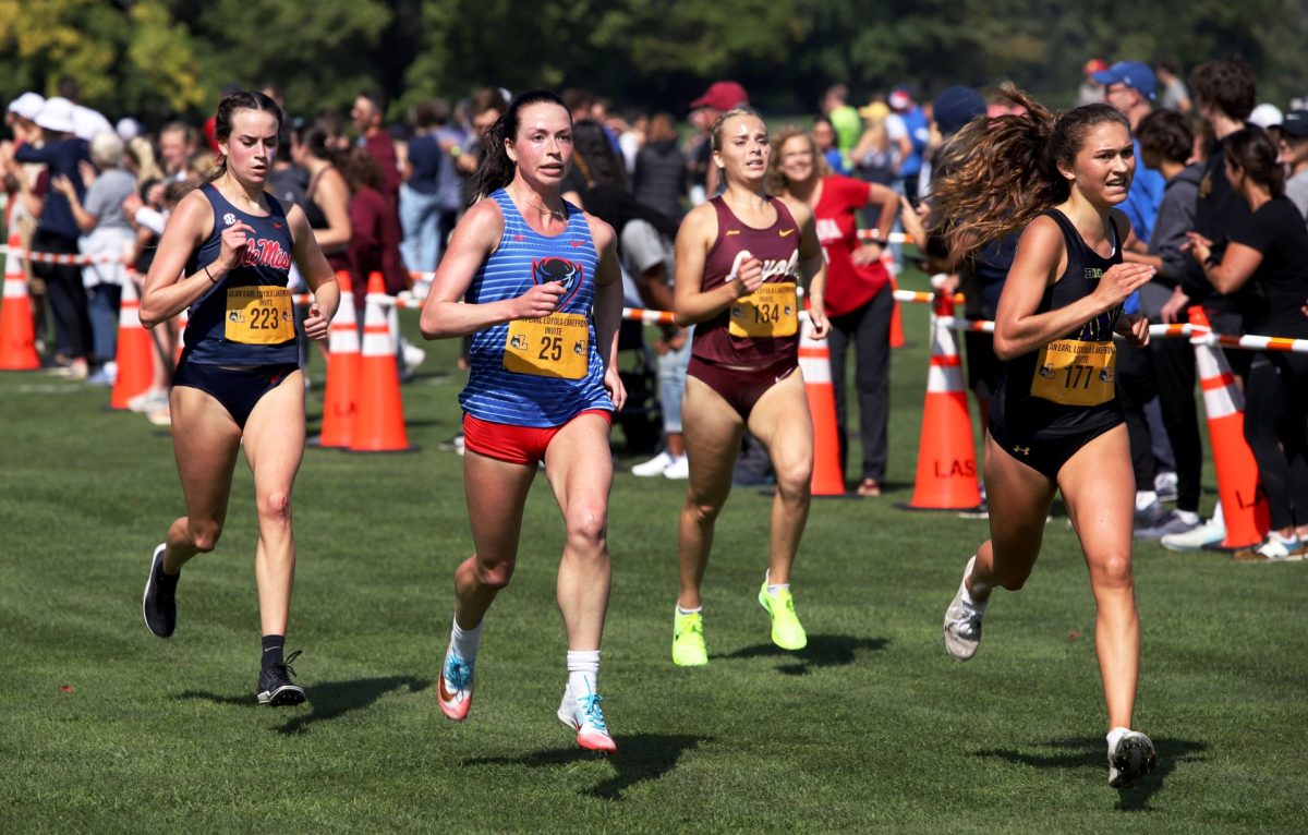 Graduate student Nina Amicon races in the Tom Cooney 6k on Friday, Sept. 29, 2023, at the Sean Earl Lakefront Invitational held at Sydney R. Marovitz golf course in Chicagos north side. Amicon finished 80th with a 21:27 time.