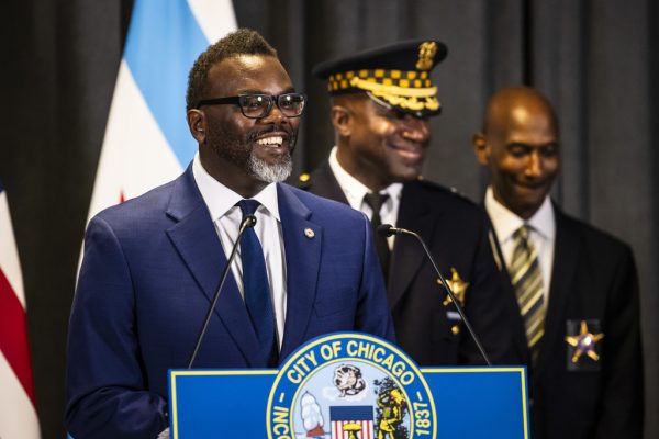 Chief Larry Snelling, center, and interim Chicago Police Department Supt. Fred Waller look on as Mayor Brandon Johnson speaks during a news conference at City Hall to announce Snelling will be the next CPD superintendent, Monday, Aug. 14, 2023. 