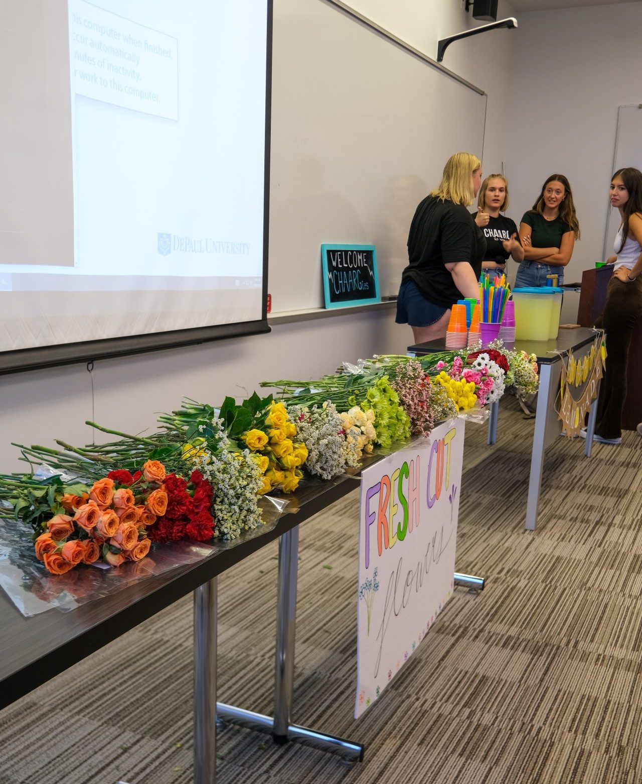 Participants chat at the DePaul CHARGG Welcome Party, Wednesday,  Sept. 20, at the Arts and Letters Hall. Current and prospective members made flower bouquets they got to take home. 