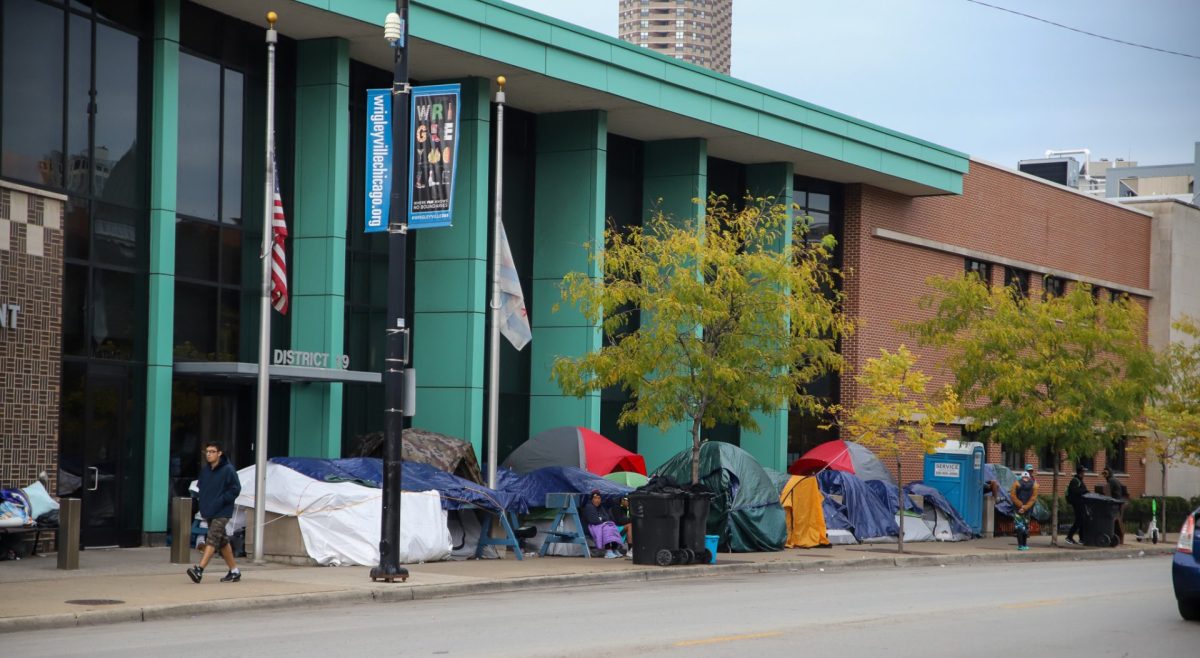 Migrants sleep outside in tents outside of the Addison Police Station on Oct. 19. Chicago is among several democratic led cities that have seen in influx in migrants since August last year.