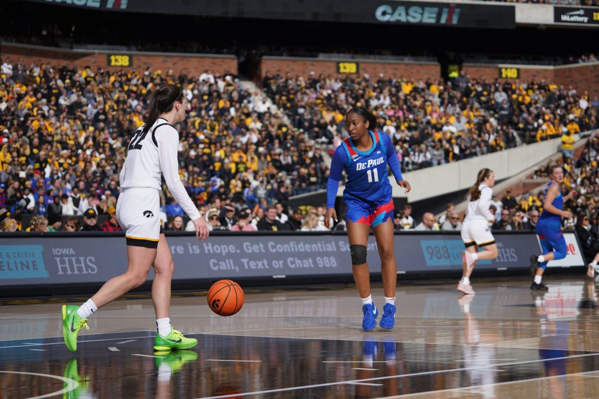 Sumer Lee guards Iowas Caitlin Clark at a DePaul-Iowa exhibition game on Oct. 15, 2023, in Iowa City, Iowa.