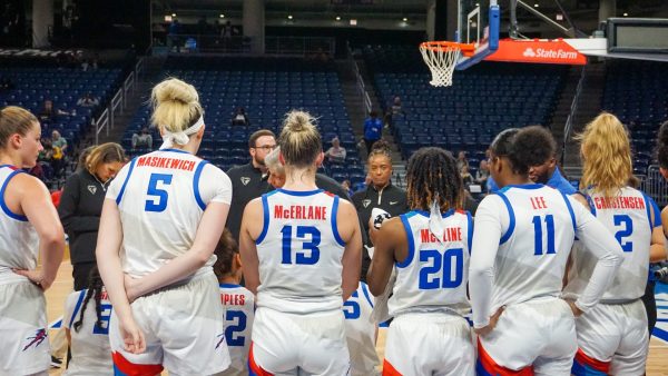 DePaul women’s basketball huddles during an exhibition game against Lewis on Oct. 29, 2023, at Wintrust Arena. 