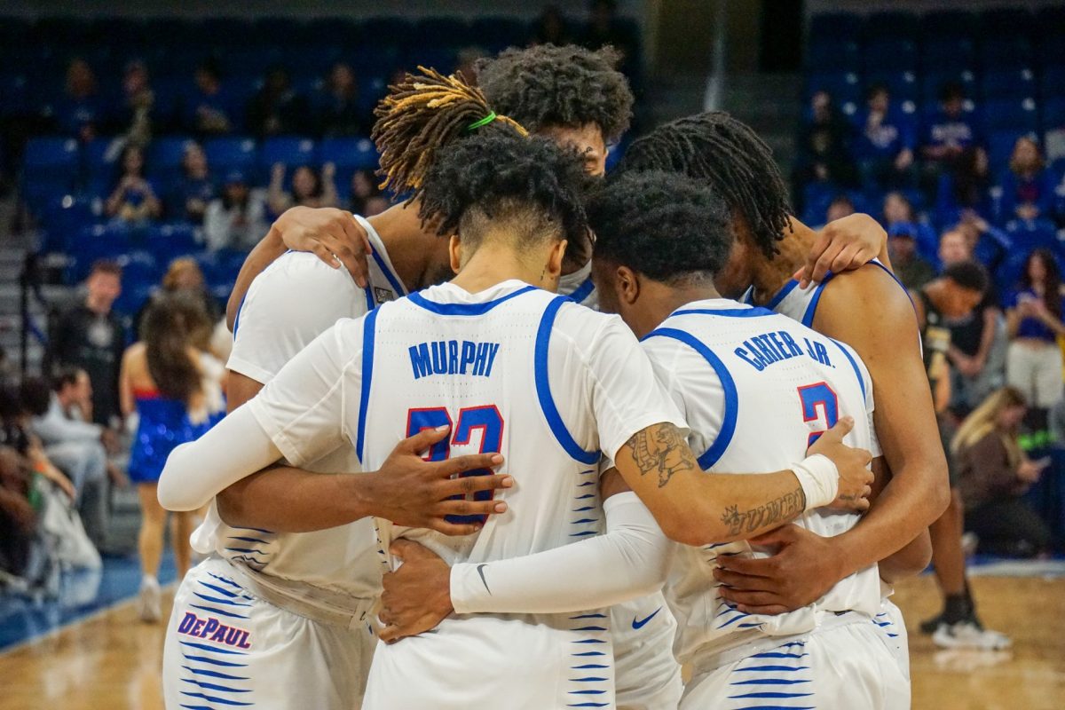 DePaul's starting five huddle before their home opener against Purdue Fort Wayne on November 7, 2023 at Wintrust Arena.