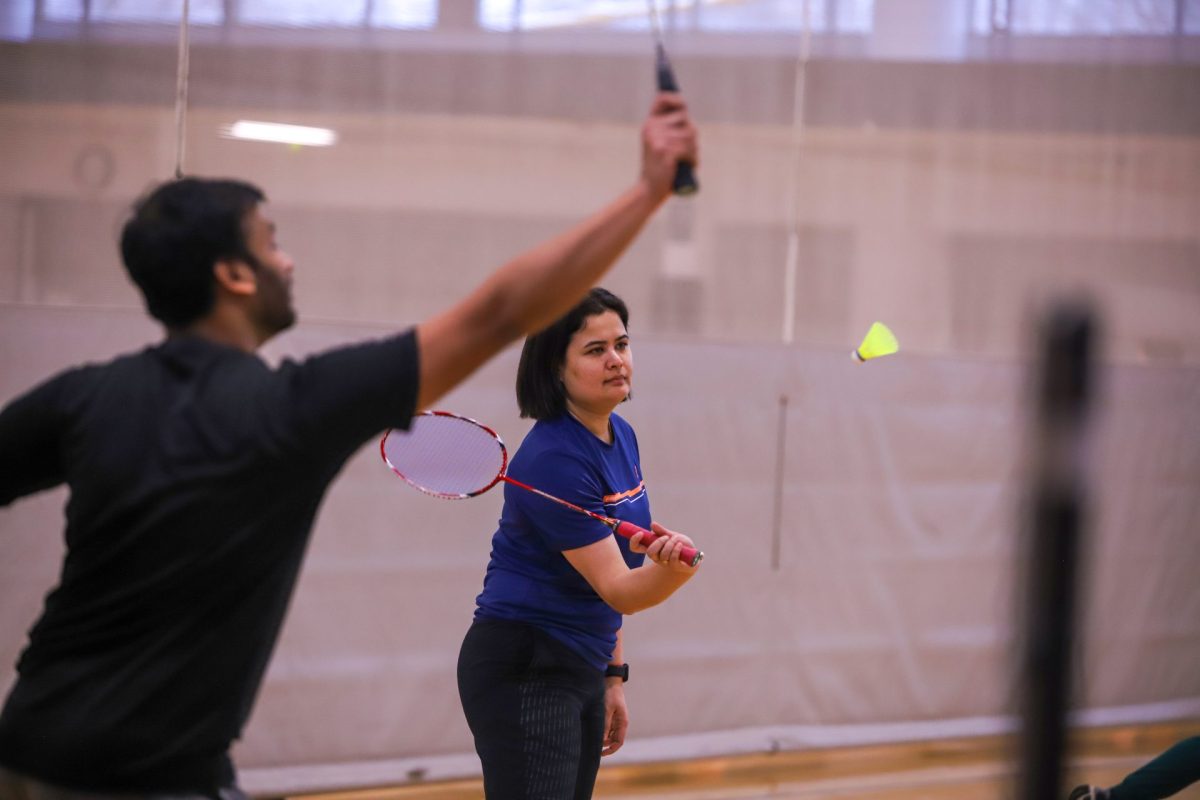 Founder and coach Pizza Bharali warms up for the DePaul Club Badmintons practice Thursday, Jan. 18, at the Ray Meyer Fitness Center.
