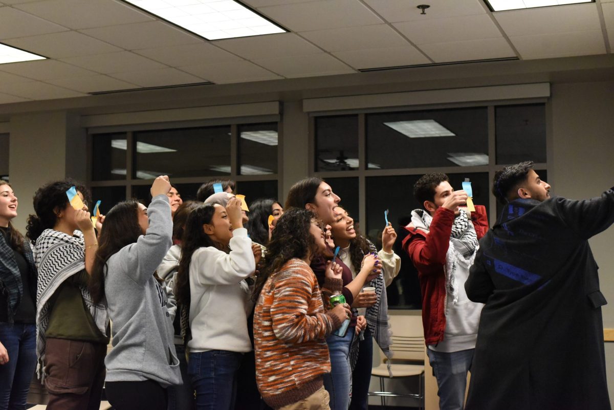 Participants pose after completing a Arabic-Spanish matching activity.