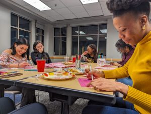 Co-president Monique Rivera (left) creates Valentine’s Day cards with Bookmark members during their monthly Art Night on Thursday, Feb. 8, 2024, in the Student Center.