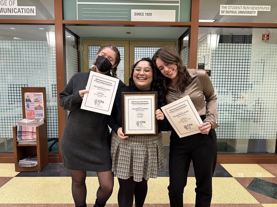 Nadia Carolina Hernandez, Editor-in-Chief, Lilly Keller, Print Managing Editor and Samantha Moilanen, Online Managing Editor, posing for a photo in front of The DePaulia bureau, in Chicago, holding a few of awards The DePaulia won on Saturday, Feb. 17, 2024. 