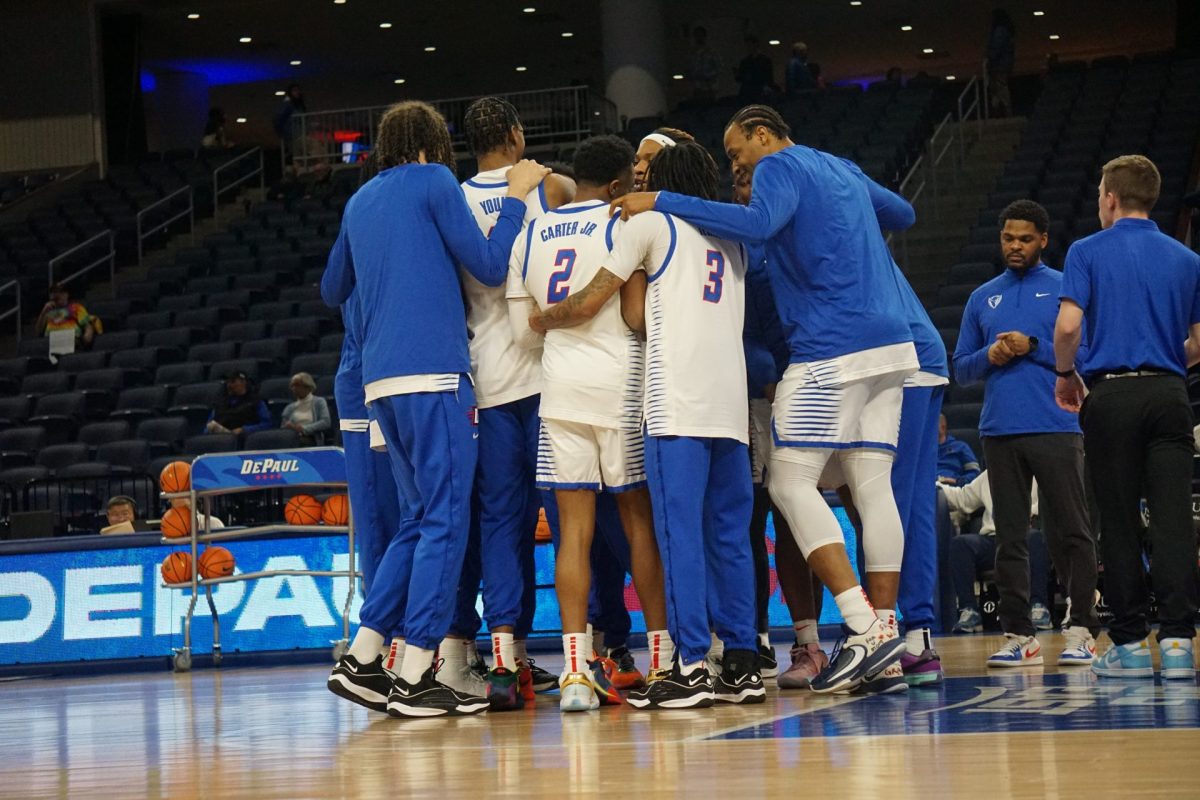 DePaul's roster huddles together during a game against St. John's Tuesday, March 5, at Wintrust Arena. Their 104-77 loss was the 19th of 20 conference losses the Blue Demons endured this season.